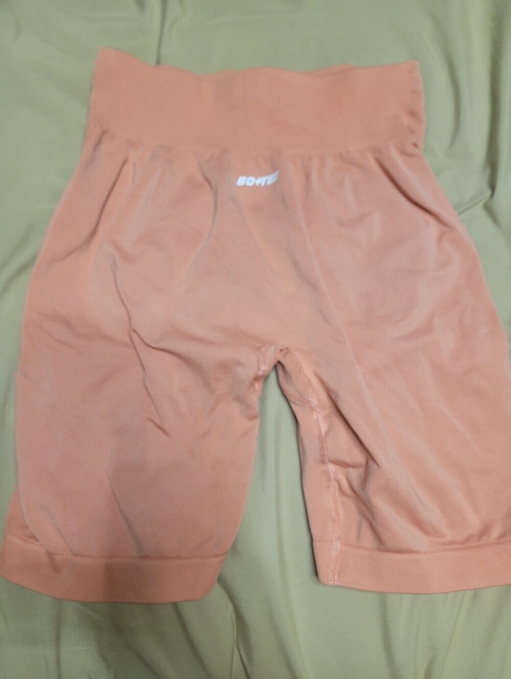 peach Bo+Tee seamless workout shorts.